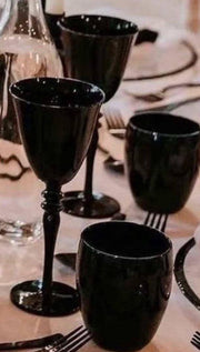 Red wine black glasses and water glasses